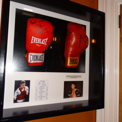 Katie Taylor is one of the most renowned boxers in Ireland. An Poitin Stil hold one of Taylor's boxing gloves for show.